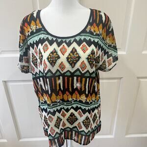 Under skies semi-sheer short sleeved blouse